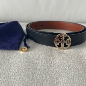 Tory Burch black leather belt, brown reverse, gold hardware.
